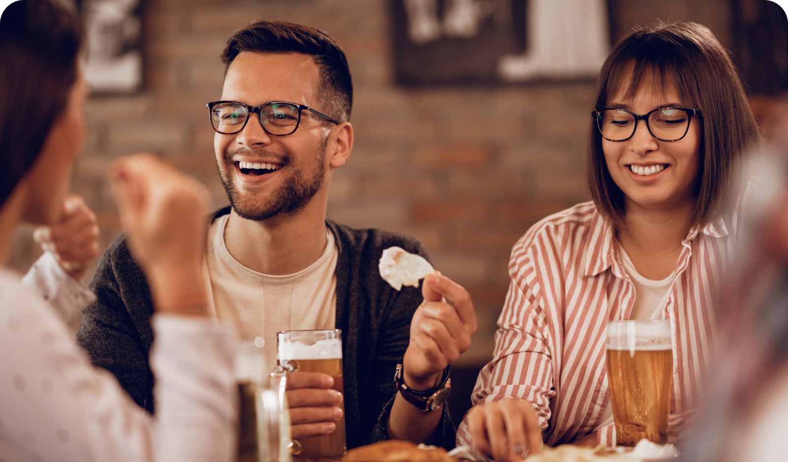 Friends enjoying drinks at a table